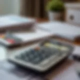 Calculator on a desk with financial documents